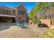 Spacious backyard patio with outdoor seating, a grill, and an impressive brick exterior offering a relaxing outdoor space at 1024 Adkins Rd, York, SC 29745
