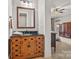 Bathroom featuring a custom wood vanity with ample storage and a stone countertop at 1024 Adkins Rd, York, SC 29745