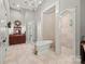Elegant bathroom with a freestanding tub, tiled shower, large vanity, and sophisticated chandelier at 1024 Adkins Rd, York, SC 29745