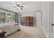 Sunlit bedroom featuring large windows and a decorative armoire and light gray walls at 1024 Adkins Rd, York, SC 29745