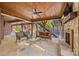 Spacious covered patio with an outdoor kitchen and multiple seating areas at 1024 Adkins Rd, York, SC 29745