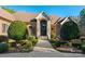 Beautiful brick home featuring an arched stone entryway, a paved walkway, and lush manicured greenery at 1024 Adkins Rd, York, SC 29745