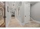 Hallway with high ceilings, arched doorways, travertine floor tiles, and decorative lighting at 1024 Adkins Rd, York, SC 29745