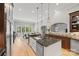 Gourmet kitchen featuring an island with a sink, stainless steel appliances, and a view of the dining area at 1024 Adkins Rd, York, SC 29745