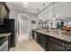 Kitchen with dark wood cabinetry, granite countertops, stainless steel appliances, and tile flooring at 1024 Adkins Rd, York, SC 29745