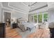 Serene main bedroom with hardwood floors, a tray ceiling, recessed lighting, and scenic window views at 1024 Adkins Rd, York, SC 29745