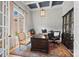 Home office featuring coffered ceilings, a large window, a decorative chandelier, and an executive desk at 1024 Adkins Rd, York, SC 29745