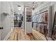 Spacious walk-in closet with custom shelving, hardwood floors, and ample storage space at 1024 Adkins Rd, York, SC 29745