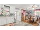 Cozy kitchen and dining area with white cabinetry and hardwood floors at 110 S Westover Dr, Monroe, NC 28112