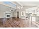 Open living room and kitchen with vaulted ceiling and hardwood floors at 1124 Cameo Ct, Charlotte, NC 28270