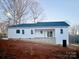 Rear view of a white house with a large backyard at 118 Stockbridge Ln, Statesville, NC 28677