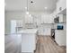 Spacious kitchen with white cabinets, a center island and stainless steel appliances at 118 Stockbridge Ln, Statesville, NC 28677