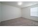 Bright bedroom featuring neutral carpeting and window blinds at 120 Fern Ln, Troutman, NC 28166