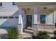 Front entry with stone accents and a dark brown door at 120 Fern Ln, Troutman, NC 28166