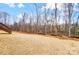 A spacious backyard with a hill leading to a house that's great for entertaining at 122 Stockbridge Ln, Statesville, NC 28625