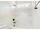 Clean bathroom with tub and shower combination and built-in shelving at 122 Stockbridge Ln, Statesville, NC 28625