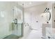 Bathroom featuring a glass-enclosed shower, soaking tub, and modern fixtures at 122 Stockbridge Ln, Statesville, NC 28625