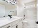 Well-lit bathroom featuring a modern vanity and bathtub with a shower at 122 Stockbridge Ln, Statesville, NC 28625