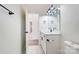 Bathroom with white marble look floors, modern vanity, and hall access at 122 Stockbridge Ln, Statesville, NC 28625