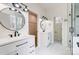 Luxurious bathroom with double vanities, modern fixtures, and elegant tile flooring at 122 Stockbridge Ln, Statesville, NC 28625