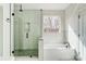 Modern bathroom featuring a glass enclosed shower, soaking tub, and matte black hardware at 122 Stockbridge Ln, Statesville, NC 28625