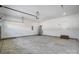 Well-lit garage featuring concrete floors, water heater, and a convenient door to the home's interior at 122 Stockbridge Ln, Statesville, NC 28625