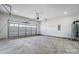 Spacious garage with an insulated door, concrete flooring, bright lighting and ample room for storage at 122 Stockbridge Ln, Statesville, NC 28625