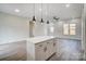 Open-concept kitchen with a center island and seamless flow to the living area at 122 Stockbridge Ln, Statesville, NC 28625