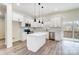 Modern kitchen with white cabinets, stainless steel appliances, and a center island at 122 Stockbridge Ln, Statesville, NC 28625