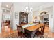 Formal dining room with hardwood floors, a large table, and chandelier at 135 Yellowbell Rd, Mooresville, NC 28117