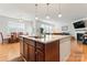 Kitchen island with granite countertop and breakfast bar seating at 135 Yellowbell Rd, Mooresville, NC 28117