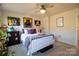 Bright bedroom with white metal bed frame and purple bedding at 138 Lanyard Dr # B, Mooresville, NC 28117