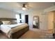 Spacious bedroom with large bed, dresser, and full-length mirror at 138 Lanyard Dr # B, Mooresville, NC 28117