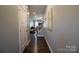 Bright entryway with dark hardwood floors and view to living room at 138 Lanyard Dr # B, Mooresville, NC 28117