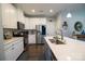 Modern kitchen with white cabinets and stainless steel appliances at 138 Lanyard Dr # B, Mooresville, NC 28117