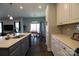 Kitchen with island, white cabinets, and breakfast bar at 138 Lanyard Dr # B, Mooresville, NC 28117