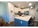 Modern kitchen with island, stainless steel appliances, and white cabinetry at 138 Lanyard Dr # B, Mooresville, NC 28117