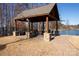 Lakeside gazebo with stone patio and seating, great for outdoor gatherings at 138 Lanyard Dr # B, Mooresville, NC 28117