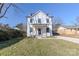 Charming two-story home with white siding and a landscaped lawn at 1408 Camp Greene St, Charlotte, NC 28208