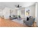 Spacious living room with hardwood floors, neutral decor, and large windows at 1408 Camp Greene St, Charlotte, NC 28208