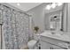 Clean bathroom with a shower/tub combo and updated vanity at 15044 New Amsterdam Ln, Charlotte, NC 28204