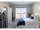 Bright bedroom with a comfortable bed and ample natural light at 15044 New Amsterdam Ln, Charlotte, NC 28204