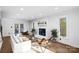 Living room with hardwood floors, fireplace, and comfortable seating area at 19634 Bustle Rd, Cornelius, NC 28031