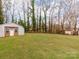 Metal and wooden storage sheds in the backyard at 205 Mae Rd, Salisbury, NC 28146