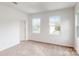 Well-lit bedroom with two windows and neutral carpeting at 248 Winford Rd, Troutman, NC 28166