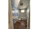 Bathroom featuring a vintage style sink, toilet, and a bath tub with white and blue accents at 2824 N Brevard St, Charlotte, NC 28205