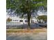 White building with parking lot and trees at 2824 N Brevard St, Charlotte, NC 28205