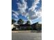 Street view of a cute single-story home with a landscaped yard and nearby neighborhood buildings at 2824 N Brevard St, Charlotte, NC 28205