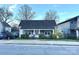 Charming single story home featuring a symmetrical facade, covered porch, and well-maintained landscaping in a residential neighborhood at 2824 N Brevard St, Charlotte, NC 28205