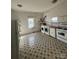 Bright kitchen featuring updated washer and dryer with a large patterned tile floor at 2824 N Brevard St, Charlotte, NC 28205
